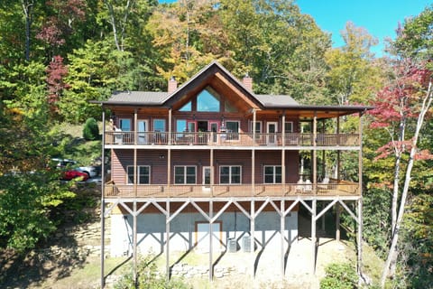 SUPER LARGE WRAP DECKS ON TWO LEVELS. ROCKING CHAIRS, SWINGS, HAMMOCK.