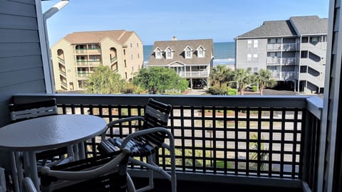 Relax on the covered 3rd floor balcony while enjoying the sounds of the ocean.