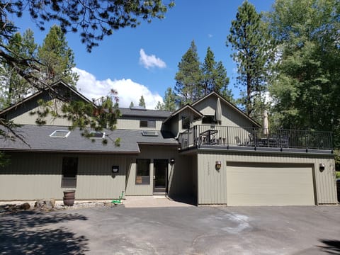 Front west side. Parking. Outdoor living over garage.