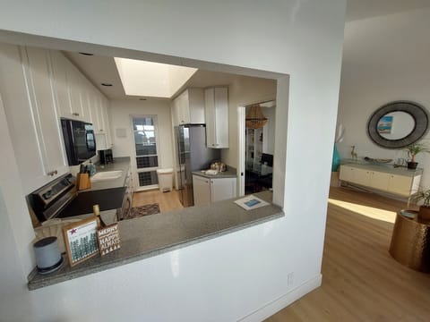 Kitchen open to dining and living areas.