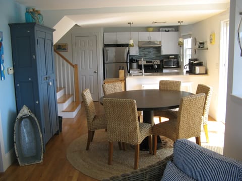 First floor living, dining and kitchen. Access to deck through sliding doors.