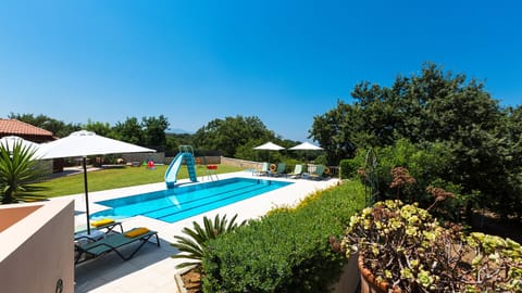 The pool area offering enough space for the whole family and full privacy