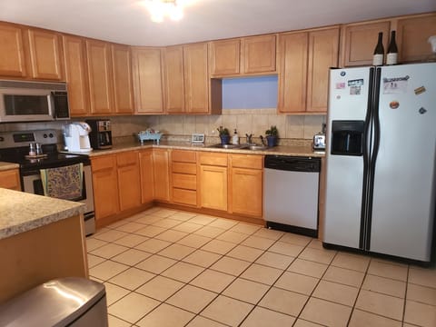 kitchen is stocked.   dishes, toaster, coffee maker, keurig.