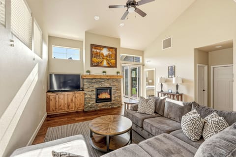 Where evenings begin. Stone fireplace glows, slider opens to patio. This is it!