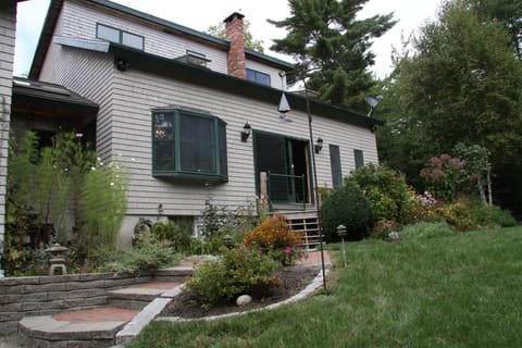 Entrance to House surrounded by gardens