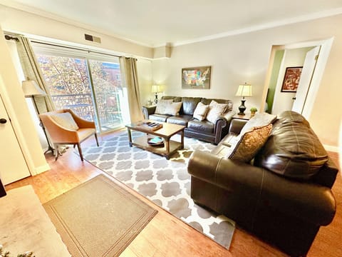 Large Living Room with leather sofas, pullout Queen bed, wood fireplace & TV/DVD