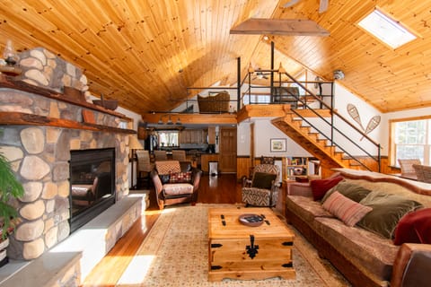 Living area with remote control gas fireplace.