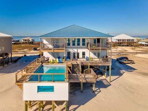 Beachfront property featuring elevated design with private pool, spacious decks, and stunning coastal views.