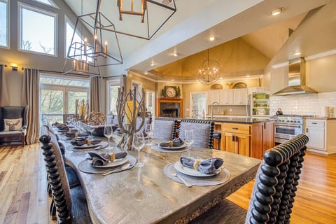 Step into elegance with a stunning upstairs living room and a grand dining room table that seats 14, perfect for hosting lavish dinners and creating unforgettable memories!