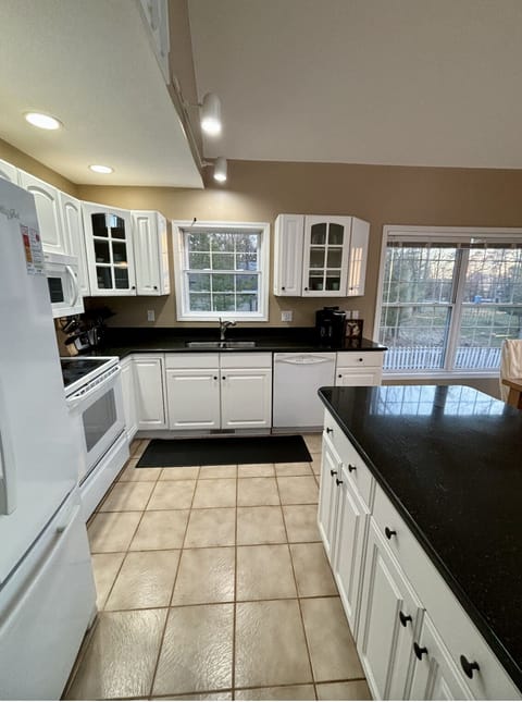 Kitchen is fully stocked with all you need to cook and prepare meals.