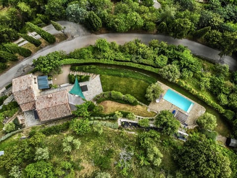 A birdseye view of Villa Rosa, a private home nestled into the Tuscan hillside  