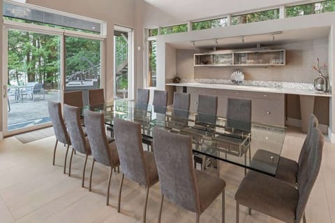 Dining for 14, plus additional seating at breakfast bar, sunken bar and outside.