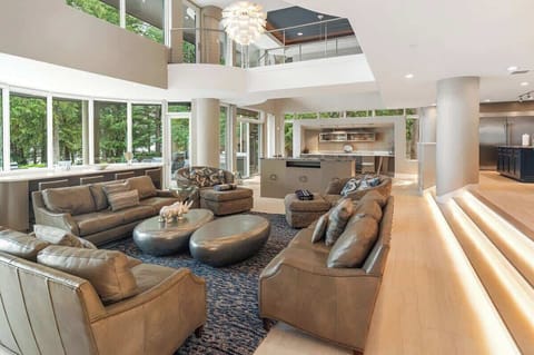 Another view of the great room highlights its expansive layout, with tall ceilings