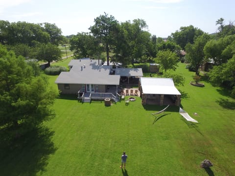 Cottage on the Left, Large Patio Area to the Right.