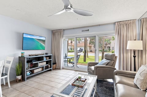 Relax on the sofa with a smart TV and patio access.