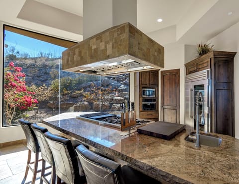 Grill indoors with the char broiler and griddle. Large commercial vent hood