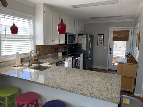 Deep double sink w/disposal; lots of counter space; ample fridge storage