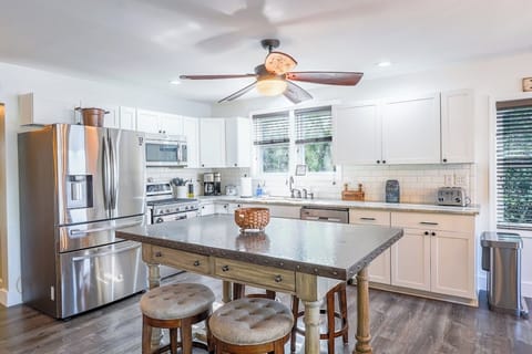 Main level open floor plan with kitchen, living room, dining room