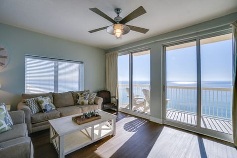Sink into plush seating while ocean waves stretch endlessly before your floor-to-ceiling windows, creating the perfect backdrop for relaxation.