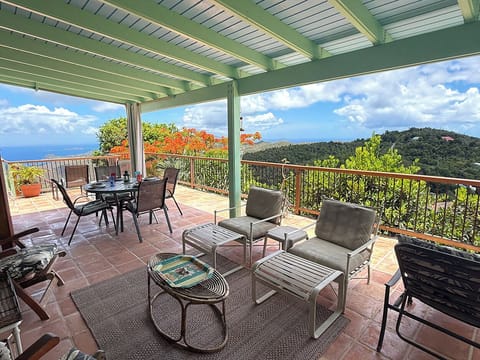 Your covered balcony at Orchid Knoll is a cozy place to relax after a day of exploring