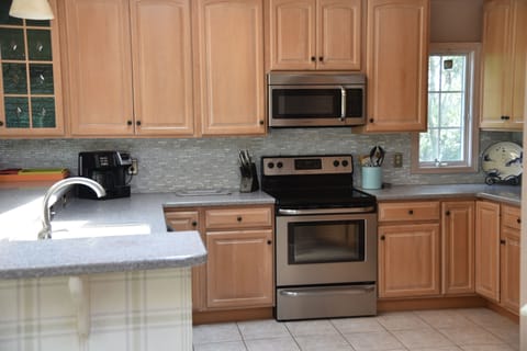 Stainless steel appliances in the bright kitchen.
