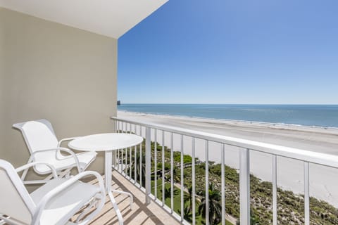 Beach view patio with bar height table and chairs for unobstructed views.