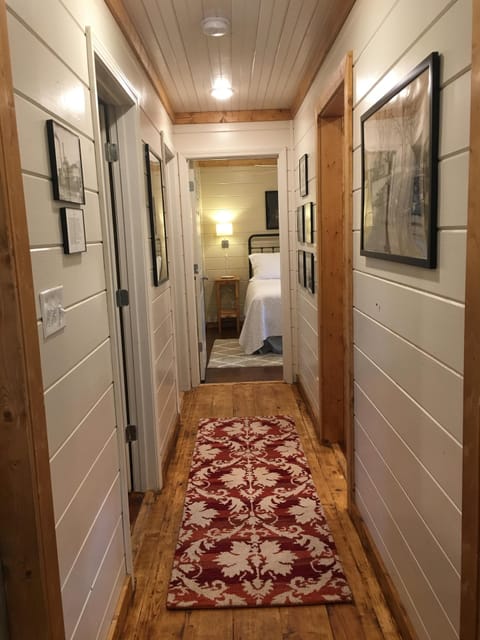 Hallway. laundry on the right, bathroom on left, bedrooms are at the end.