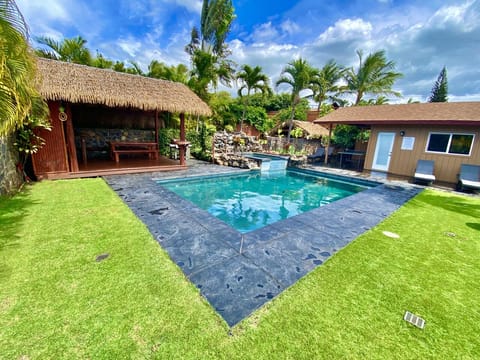 newly stained concrete and a new thatch roof on cabana