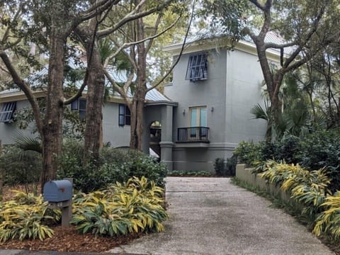 Arrive at the beach! Newly painted (green) surrounded by lush, peaceful grounds.