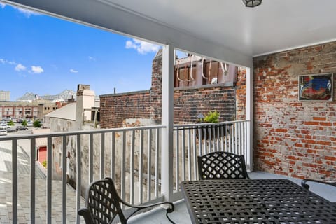 Features exposed brick walls and outdoor seating to enjoy the view of the city.