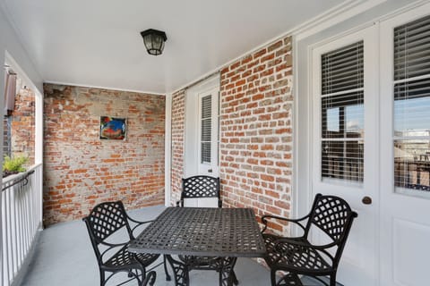 Features exposed brick walls and outdoor seating to enjoy the view of the city.