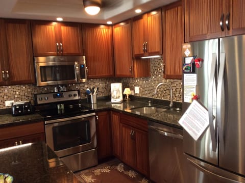 Updated kitchen with new appliances and granite countertops.   
