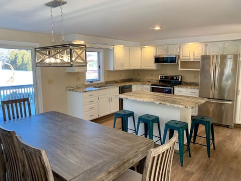 Newly remodeled kitchen with new flooring, appliances, granite, fixtures