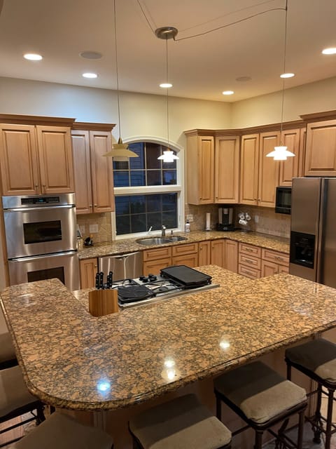 Cook and be part of the conversation at the extra large island with six stools