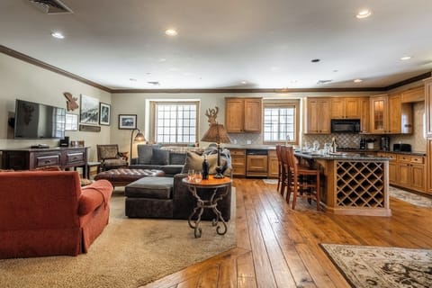 The Charming Chalet's open-concept layout connects the kitchen, dining, and living areas, making it easy to gather and spend time together.