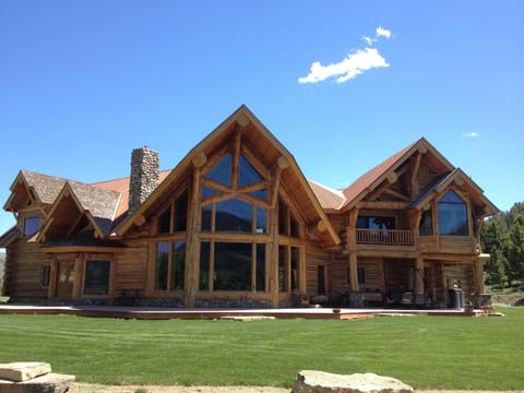 lodge front with deck, yard, fire pit area
