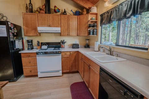 The kitchen comes fully stocked with cookware and utensils—perfect for preparing anything from quick breakfasts to full family dinners.