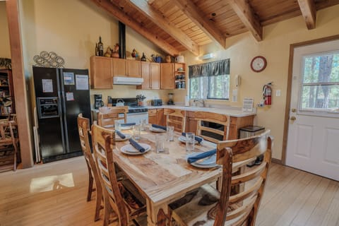 Enjoy family dinners or group meals in the inviting dining room, designed to complement the open layout.