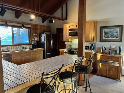 Fully stocked kitchen with complimentary spices, Keurig coffee pods, and more