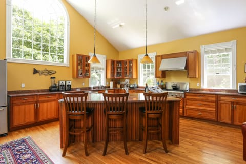 The kitchen island is a popular gathering spot.