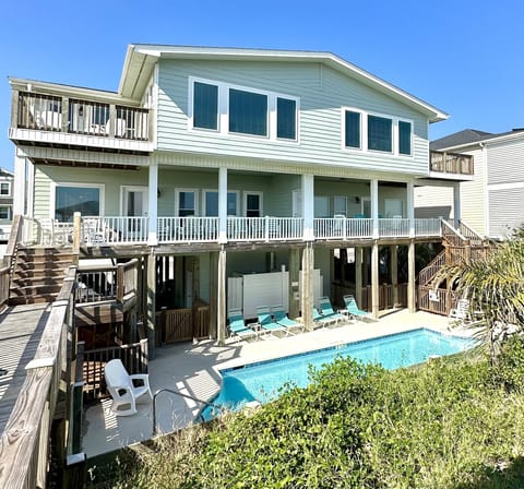 Front of beach house with pool. Eventide is on the left.