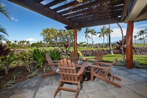 End-unit lanai with fairway and mountain views – perfect for dining al fresco or lounging in island serenity.