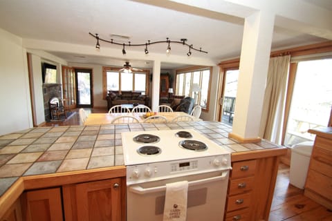 Why should the cook miss out on the memories?  Kitchen open to dining, living rm