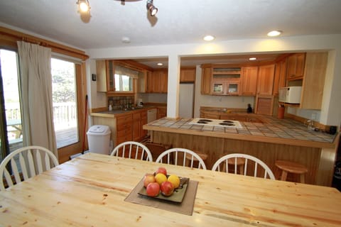 Open-concept floorplan with dining area between kitchen (shown) and living area.