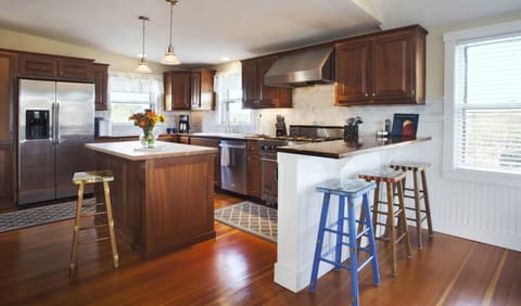 Large kitchen with top of the line appliances. Multiple countertop seating areas