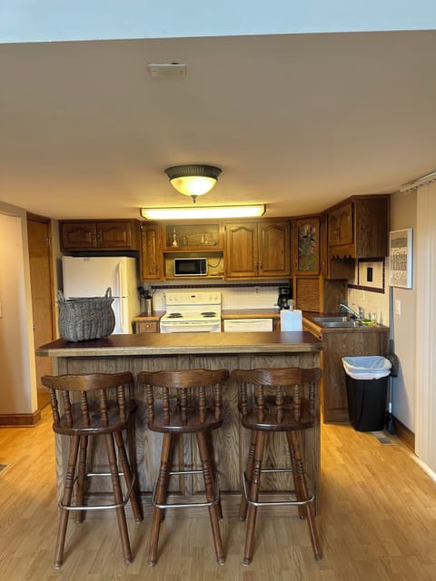 Kitchen fully stocked with pots and pans, bowels  coffee pots, utensils