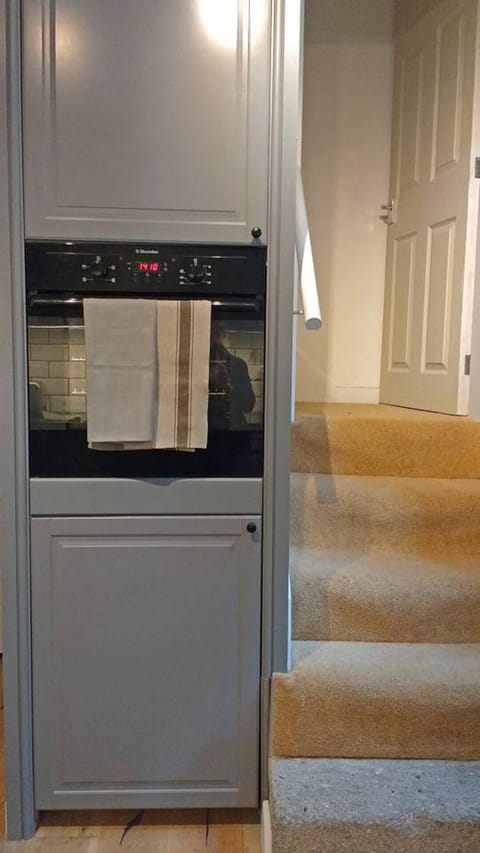 kitchen showing stairs to first floor