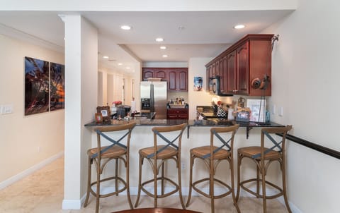 Bar stools and view into the kitchen