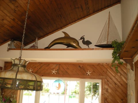 large brass dolphin in dining room