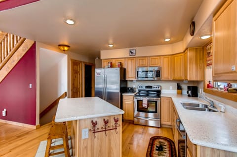 The kitchen has stainless appliances, corian counter tops and everything you will need for your stay.